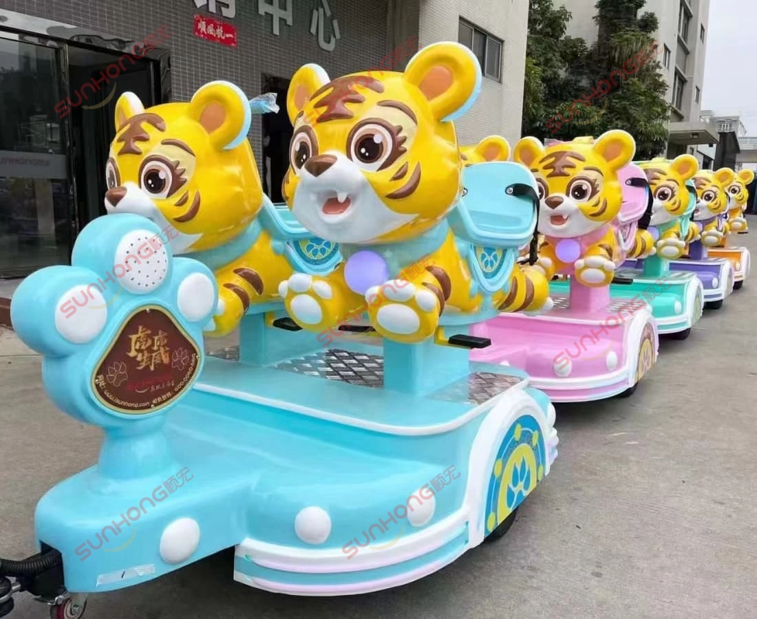 colorful-tigger-small-train-units-closeup - SUNHONG Close-up view of tiger-themed small trackless train rides in vibrant blue and pink colors, designed for kids. - SUNHONG