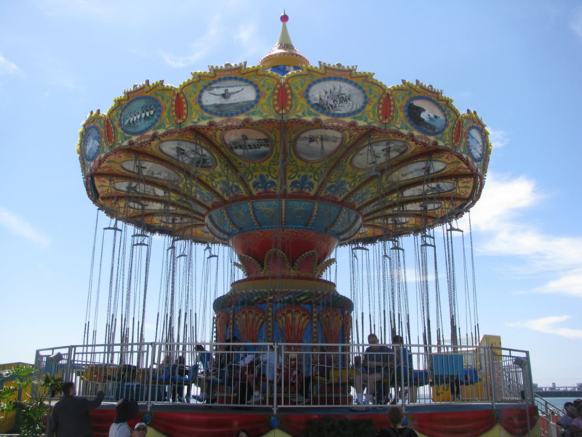 Classic fairground swing ride at Cedar Point amusement park, with ornate design.