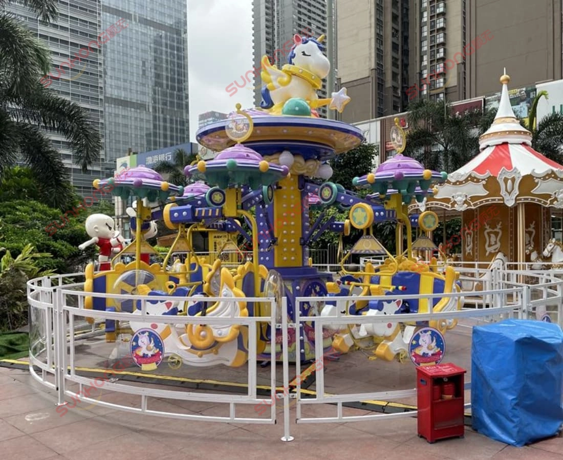 fairy-unicorn-ride-daytime-empty-view - SUNHONG Daytime view of the Fairy Unicorn Amusement Ride in a city plaza, set up and ready for operation with no riders yet. - SUNHONG