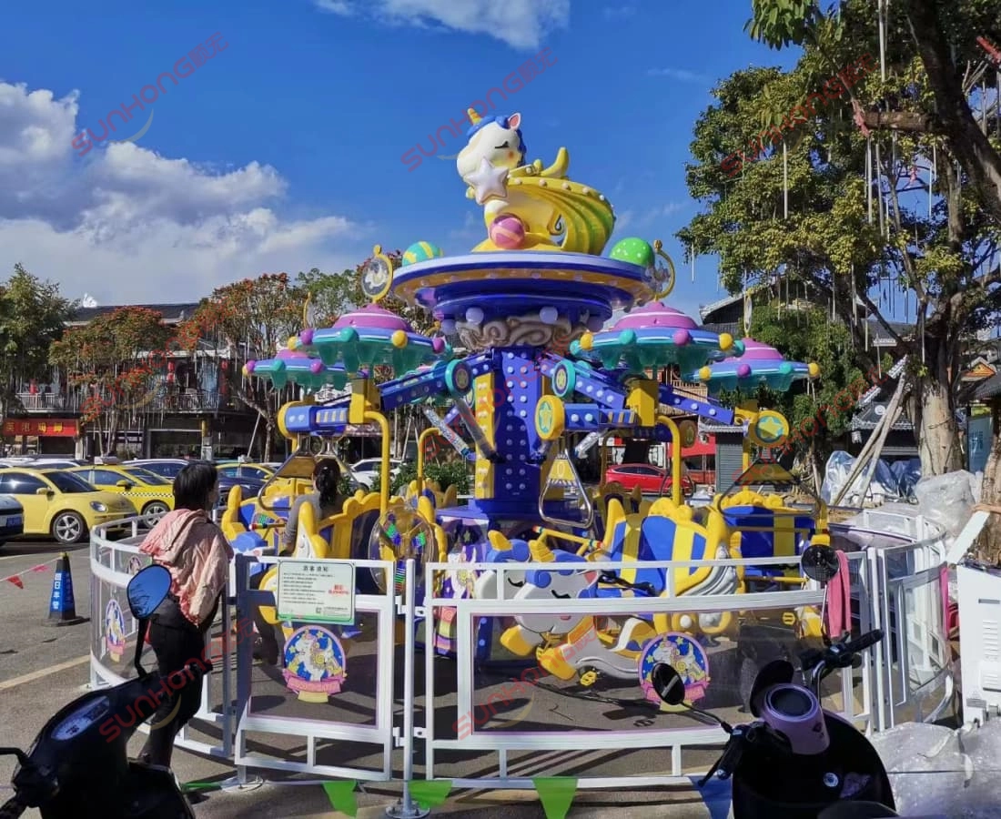 fairy-unicorn-ride-daytime-street-display - SUNHONG Fairy Unicorn Ride in daytime operation at a busy street-side location, with colorful cars and clear skies enhancing its visual appeal. - SUNHONG