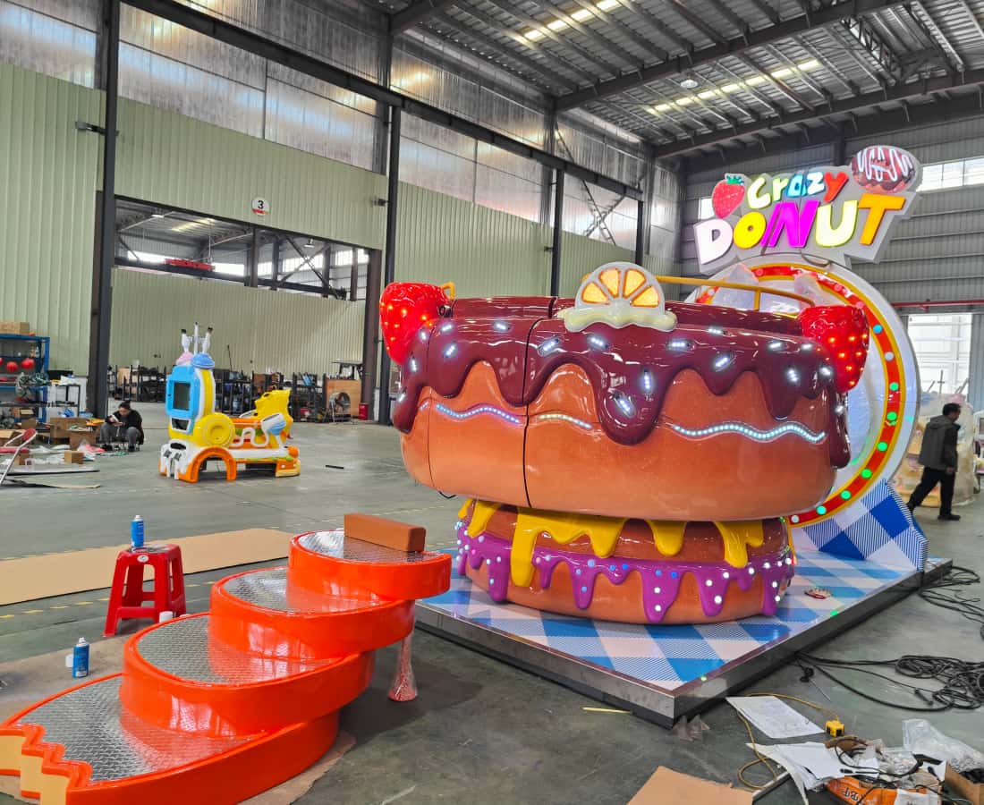 Overall side view of the Donut Tagada Ride, a 3.8m indoor tagada amusement ride at SUNHONG factory - SUNHONG