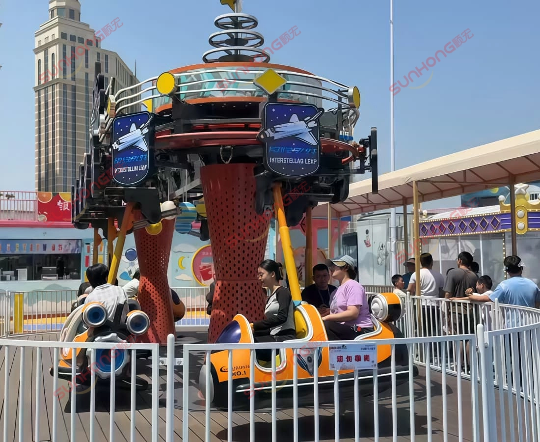 interstellar-family-plane-ride-daytime.jpg - SUNHONG Daytime view of Interstellar small plane ride with families enjoying the attraction - SUNHONG