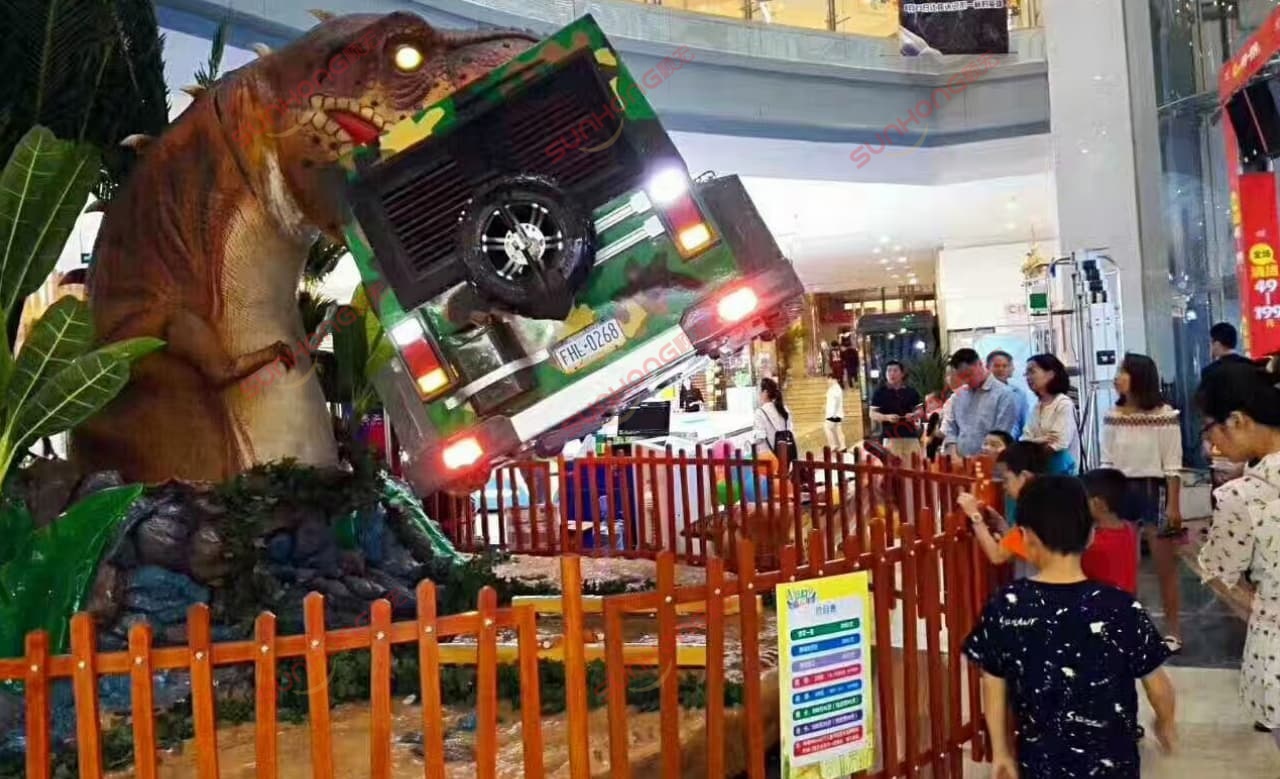 Jurassic Swinger Dinosaur Theme Indoor Mall Queue Children.jpg Jurassic Swinger dinosaur-themed extreme ride in an indoor mall with children waiting in line.