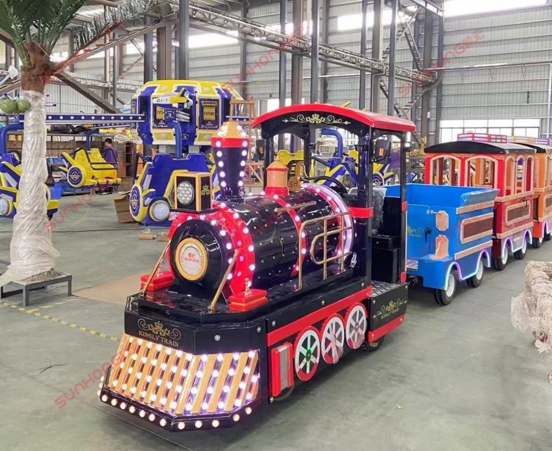 kingly-trackless-train-factory-floor.jpg Kingly trackless train in factory with LED lights, royal electric train for amusement parks