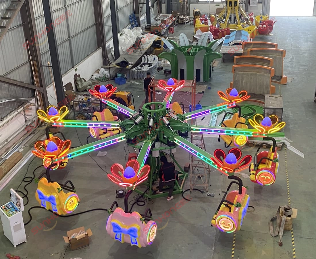 Larva-Blooms-Bounce-Ride-Asembly-at-SUNHONG - SUNHONG Pekerja memasang komponen utama Larva Blooms Bounce Ride di dalam kemudahan pengeluaran SUNHONG. - SUNHONG