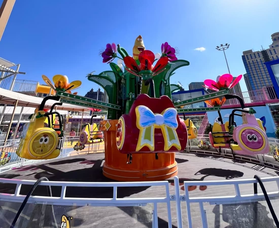Amusement park ride flower swing at Government-Backed Larva Park Project, colorful spinning attraction for children - SUNHONG
