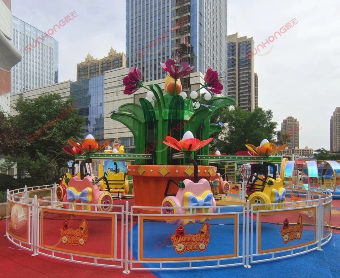 larva-mekar-industri-bangunan-pejabat-persegi - SUNHONG Larva Blooms melantun tunggangan yang beroperasi di dataran industri, dengan bangunan pejabat di latar belakang. - SUNHONG