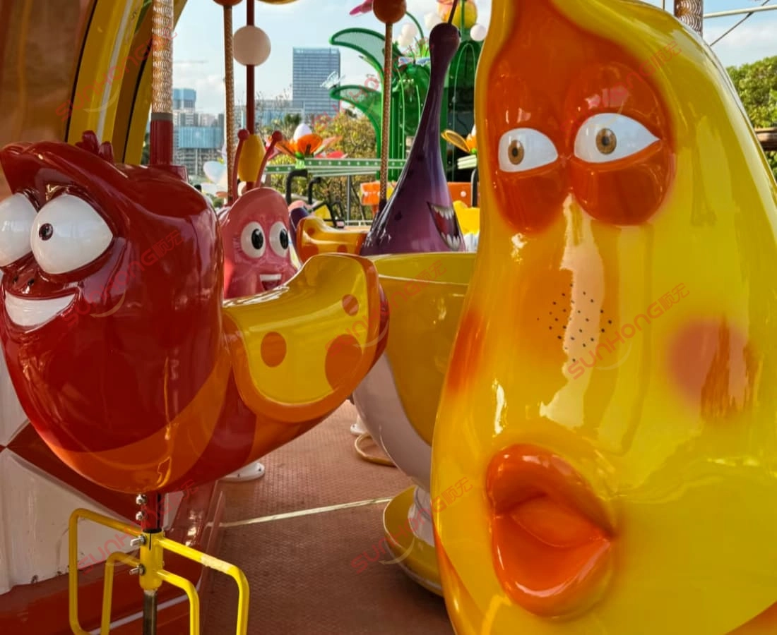 larva-carousel-closeup-animal-seats.jpg - SUNHONG Close-up of Larva carousel ride seats with themed characters and bright colors - SUNHONG