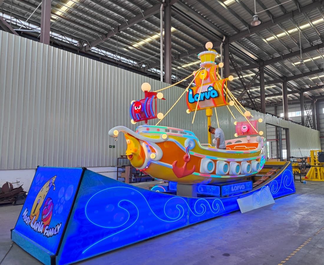 Larva Drifting pirate ship swing ride stationary at the SUNHONG factory, ready for installation in a pirate boat ride or theme park. - SUNHONG