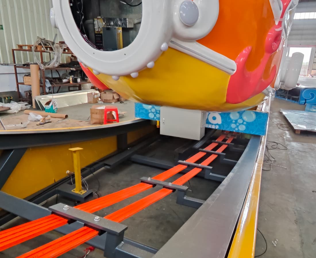 Close-up of the bottom rolling wheel of the Larva Drifting pirate ship swing ride, showcasing its unique design for smooth 360° rotation. - SUNHONG