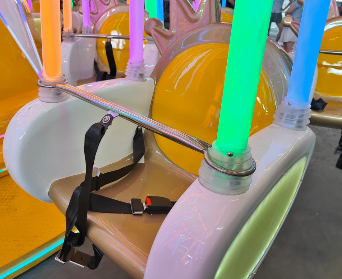 Close-up of the custom seat design on the Larva Flying Chair swing ride. - SUNHONG