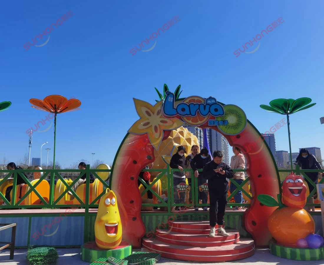 larva-fruitland-smallest-roller-coaster-exit-visitors - SUNHONG Visitors exiting through Larva-themed sign after riding the smallest roller coaster Larva Fruitland. - SUNHONG