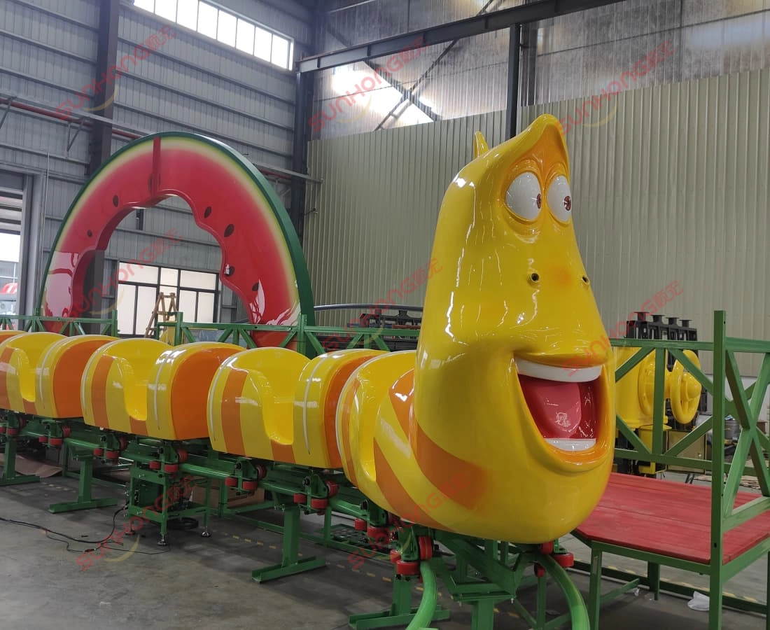 larva-fruitland-yellow-mini-coaster-front-car - SUNHONG Close-up of Yellow character front car from Larva Fruitland mini roller coaster during assembly. - SUNHONG