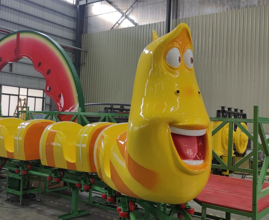 Front view of the Larva Mini Roller Coaster, currently being installed at SUNHONG factory as part of the Larva Fruitland ride. - SUNHONG