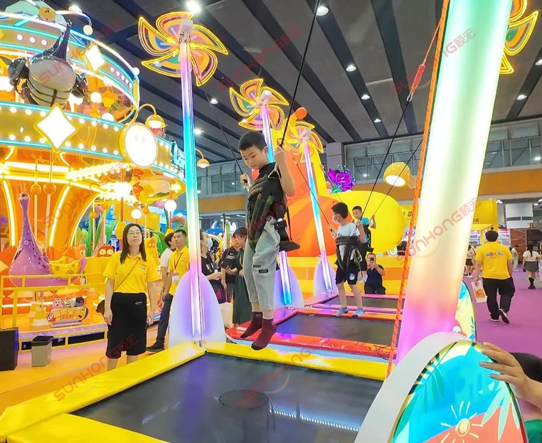 larva-pinwheel-trampoline-kid-jumping - SUNHONG A child enjoying the Larva Pinwheel Trampoline in a safe and colorful play experience - SUNHONG