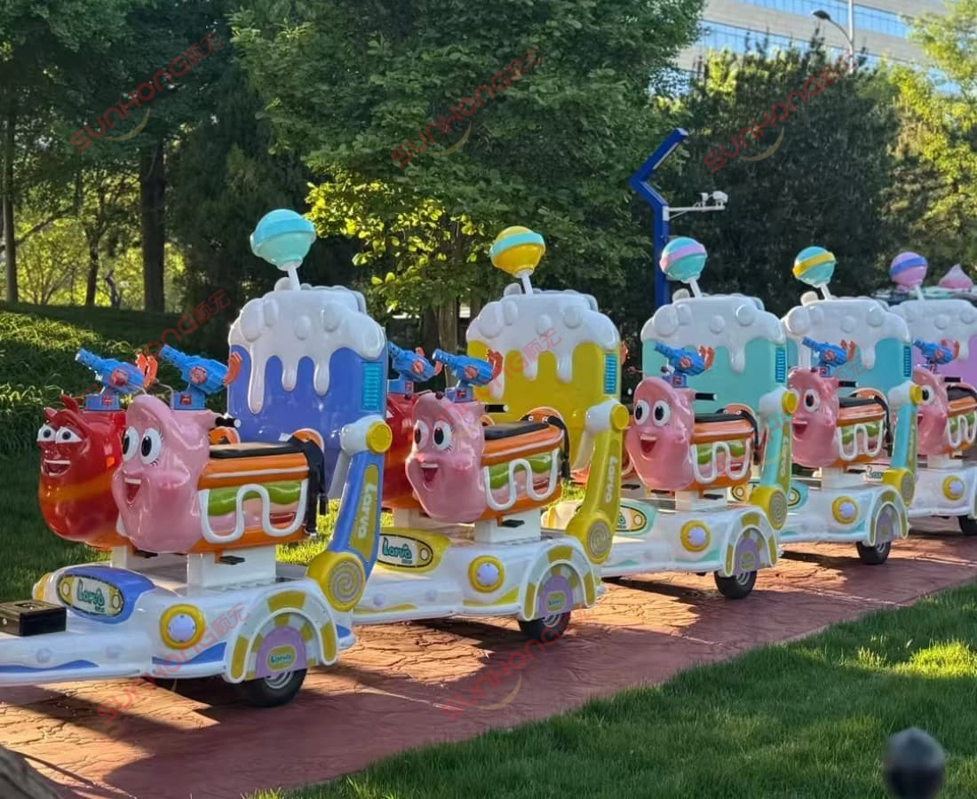 larva-ranger-trackless-train-on-park-path - SUNHONG Trackless Larva Ranger train ride for sale cruising a scenic park path bordered by green grass — ideal for outdoor parks. - SUNHONG