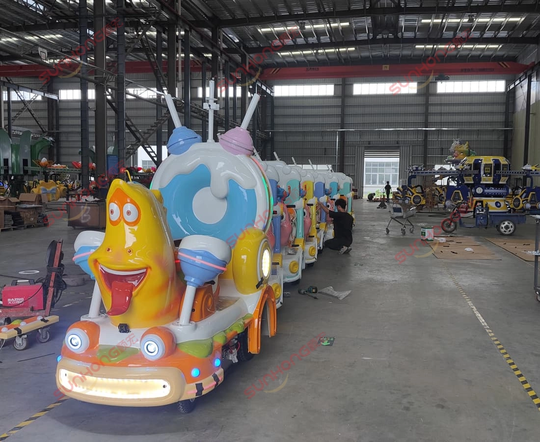 larva-ranger-train-full-view-sunhong-workshop - SUNHONG Full view of the trackless Larva Ranger train ride inside SUNHONG’s production workshop – reliable quality manufacturing. - SUNHONG
