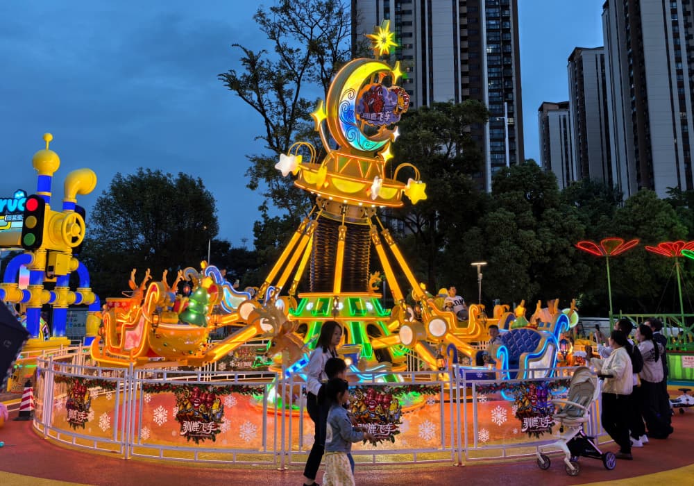 Larva Reindeer Sleigh amusement equitment in the family Larva Theme park at night