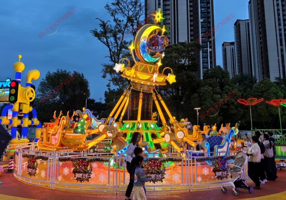 Larva Reindeer Sleigh amusement equitment in the family Larva Theme park at night Larva Reindeer Sleigh amusement equitment in the family Larva Theme park at night