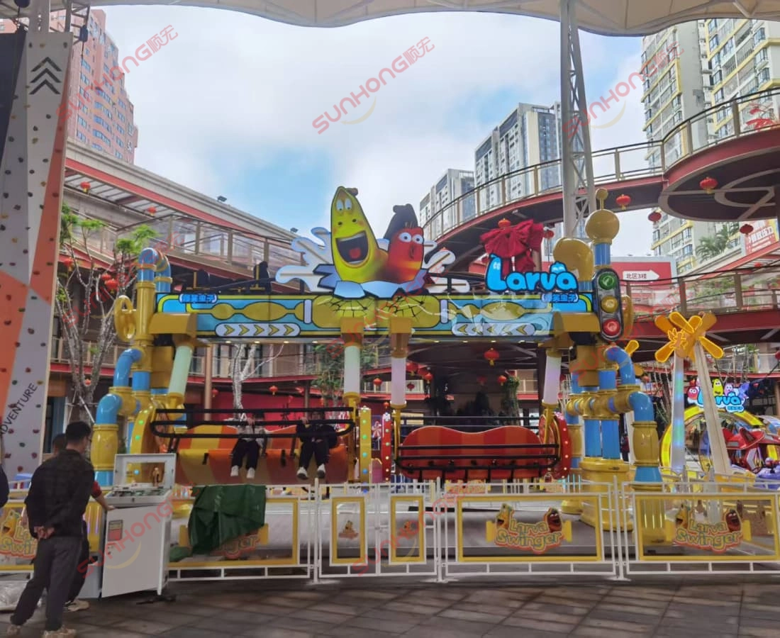 larva-swing-ride-for-sale-commercial-square-two-riders - SUNHONG Larva Swing ride for sale installed in commercial plaza with two riders. - SUNHONG