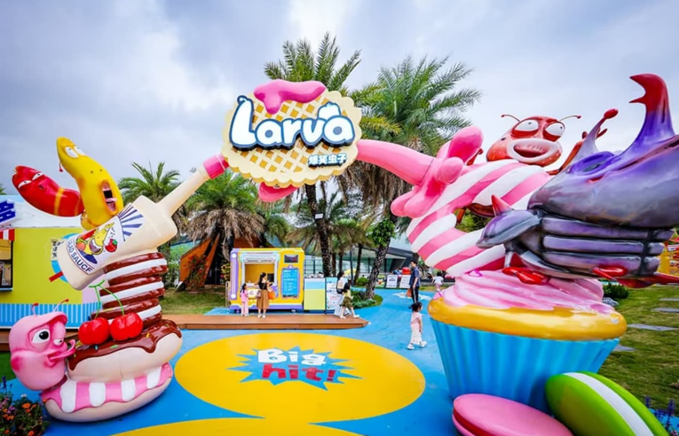 Colorful entrance gate of Larva-themed amusement park featuring popular cartoon characters, dessert elements, and playful design for kids and families. - SUNHONG