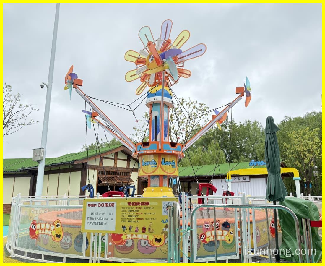 3D rendering of the Larva Windmill Trampoline set in a Larva-themed amusement park background. - SUNHONG