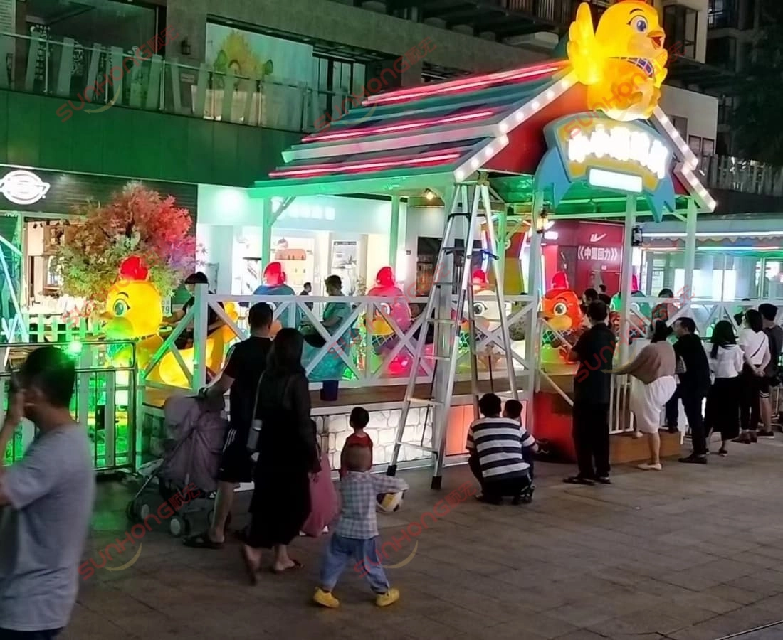 little-chicken-coaster-ride-popular-night - SUNHONG Indoor test setup of Little Chicken Team kiddie coaster ride with windmill decoration - SUNHONG