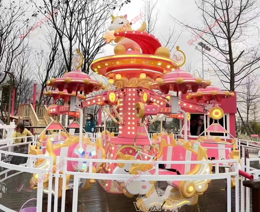 red-fairy-unicorn-ride-daytime-street-display - SUNHONG Red Fairy Unicorn Amusement Ride operating outdoors during the day in a street-side location, attracting families and kids. - SUNHONG