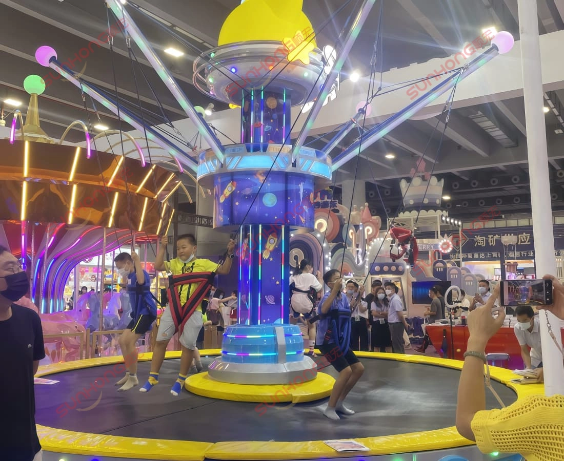 space-jump-bungee-ride-kids-playing-exhibition - SUNHONG Children actively playing on Space Jump ride at an exhibition event - SUNHONG