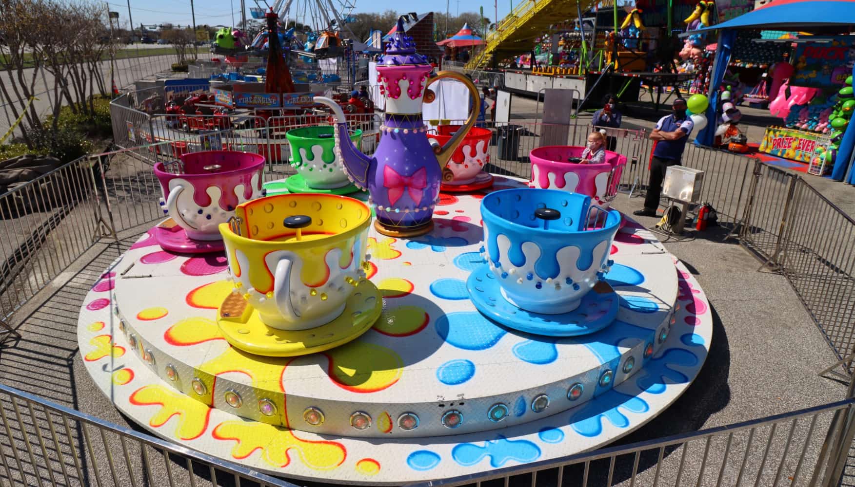 Spinning Amusement Park Rides-Teacups Colorful spinning teacup ride at a fair.