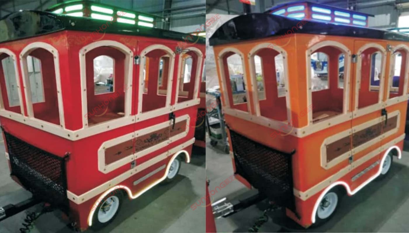 trackless-train-carriage-shells Red and orange fiberglass carriage shells under construction – bodywork stage in building a trackless train