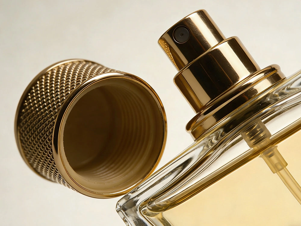 Close-up of a perfume bottle with its golden cap removed, showing the sprayer and liquid. - Kartun