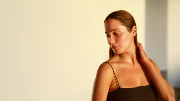 a woman doing face yoga a woman doing face yoga
