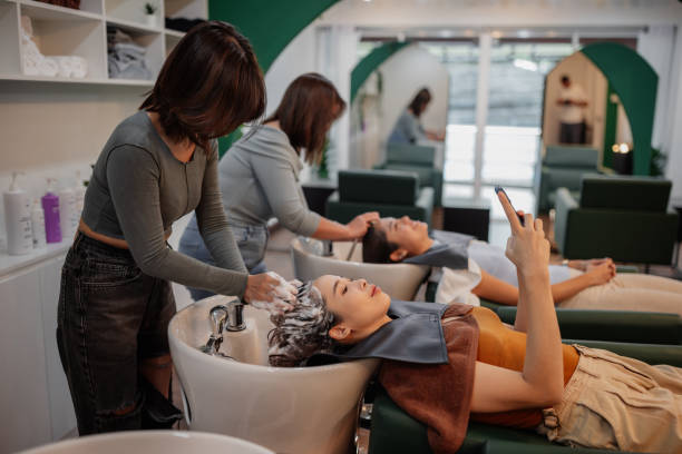 Aroma shampoo being applied to hair in salon. Aroma shampoo being applied to hair in salon.