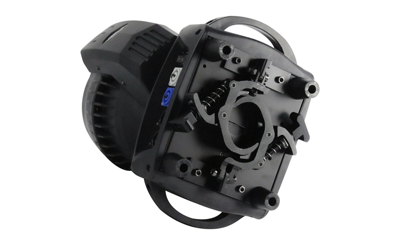 Black metal moving head light with a white background