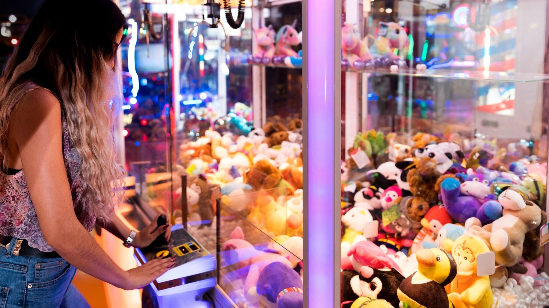 sideways-woman-playing-arcade-machine_23-2148253125