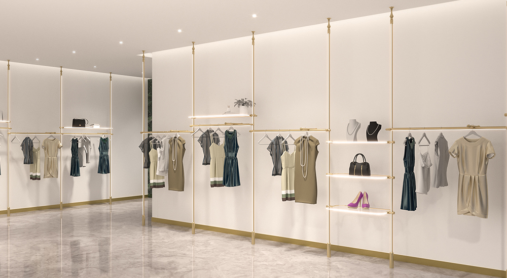 Elegant gold retail display modular system showcasing women's apparel and accessories.