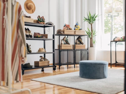 Retail-shoe-display-shelves-stocked-with-colorful-shoes-and-accessories. Retail shoe display shelves stocked with colorful shoes and accessories.
