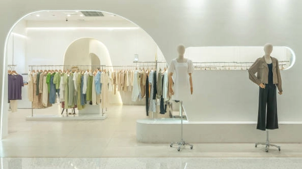 Modern-clothing-solutions-store-interior-with-mannequins-displaying-stylish-apparel. Modern clothing solutions store interior with mannequins displaying stylish apparel.