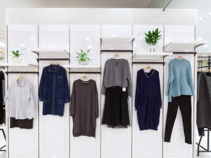 Modern clothing display rack with stylish apparel.