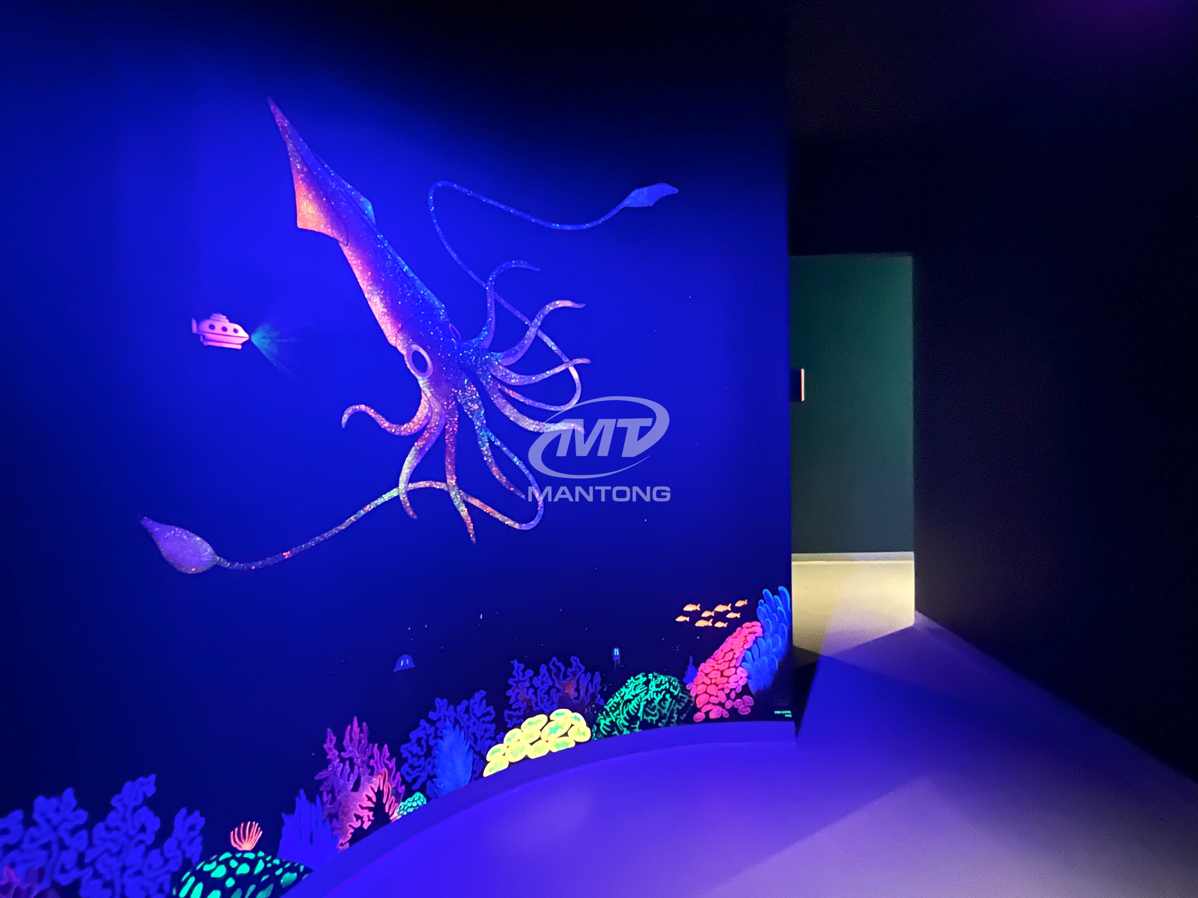 interactive wall projection Glowing squid and coral on an interactive wall projection.