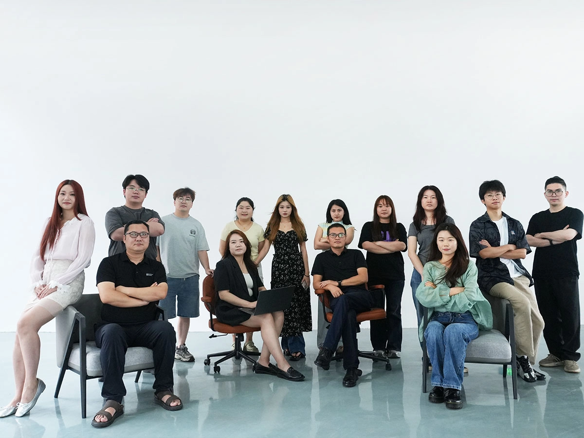 A diverse group of professional colleagues posing together in a bright studio. - KeMore