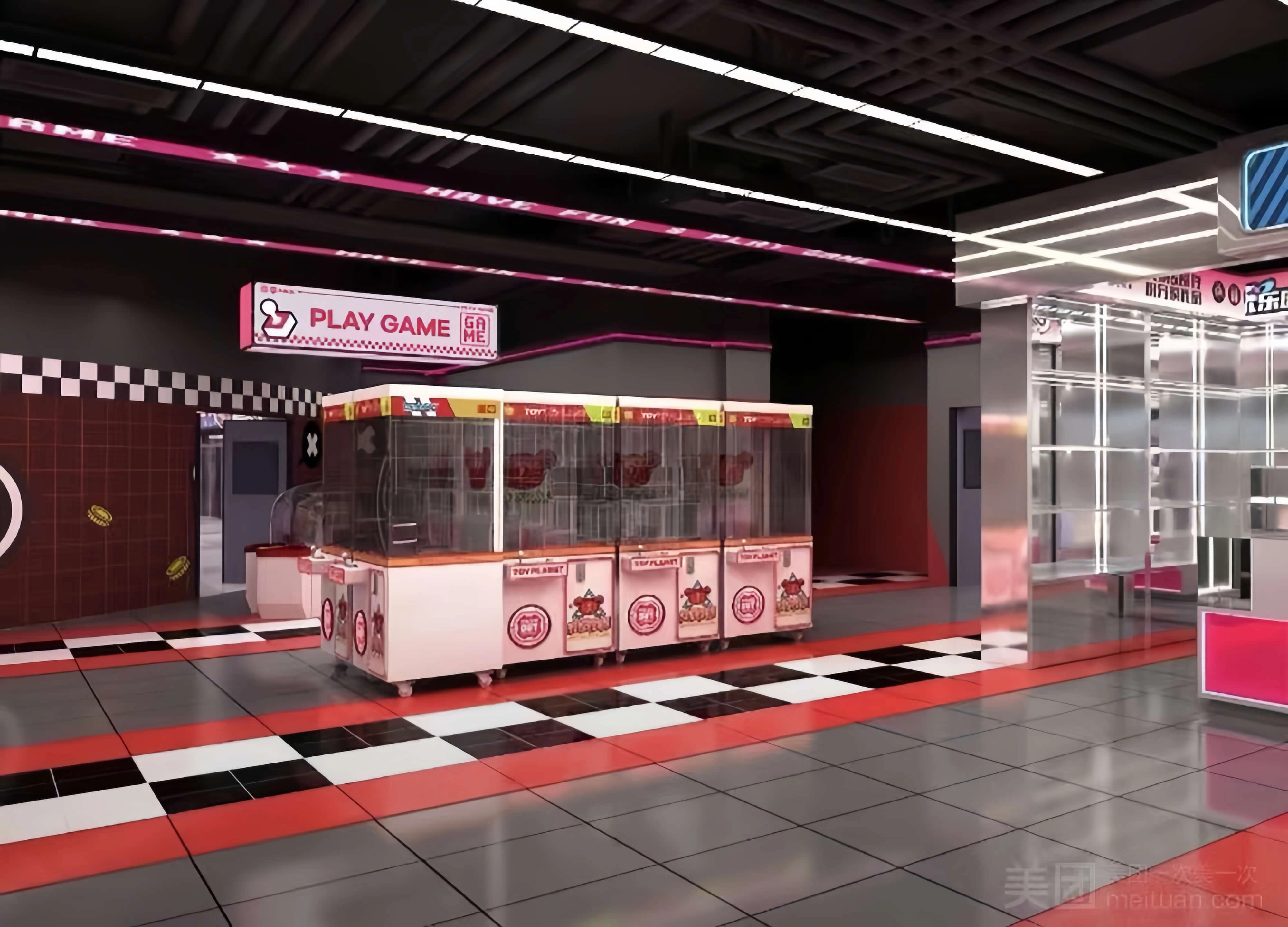Custom claw machine arcade game center with pink and red themed claw machines.