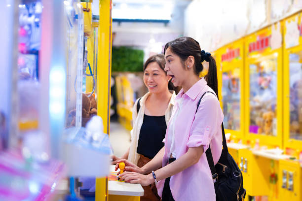 Claw machines in an arcade create a dynamic, thrilling environment that draws in customers seeking fun, competitive, and rewarding gaming experiences.