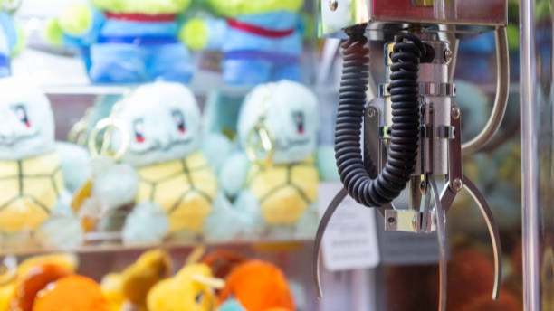 Prize machines claw game with plush toys.