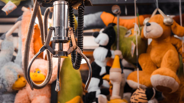 Good claw machine poised above plush toys.