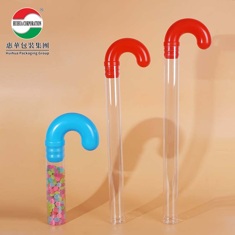 Clear plastic candy cane bottle with a red curved cap