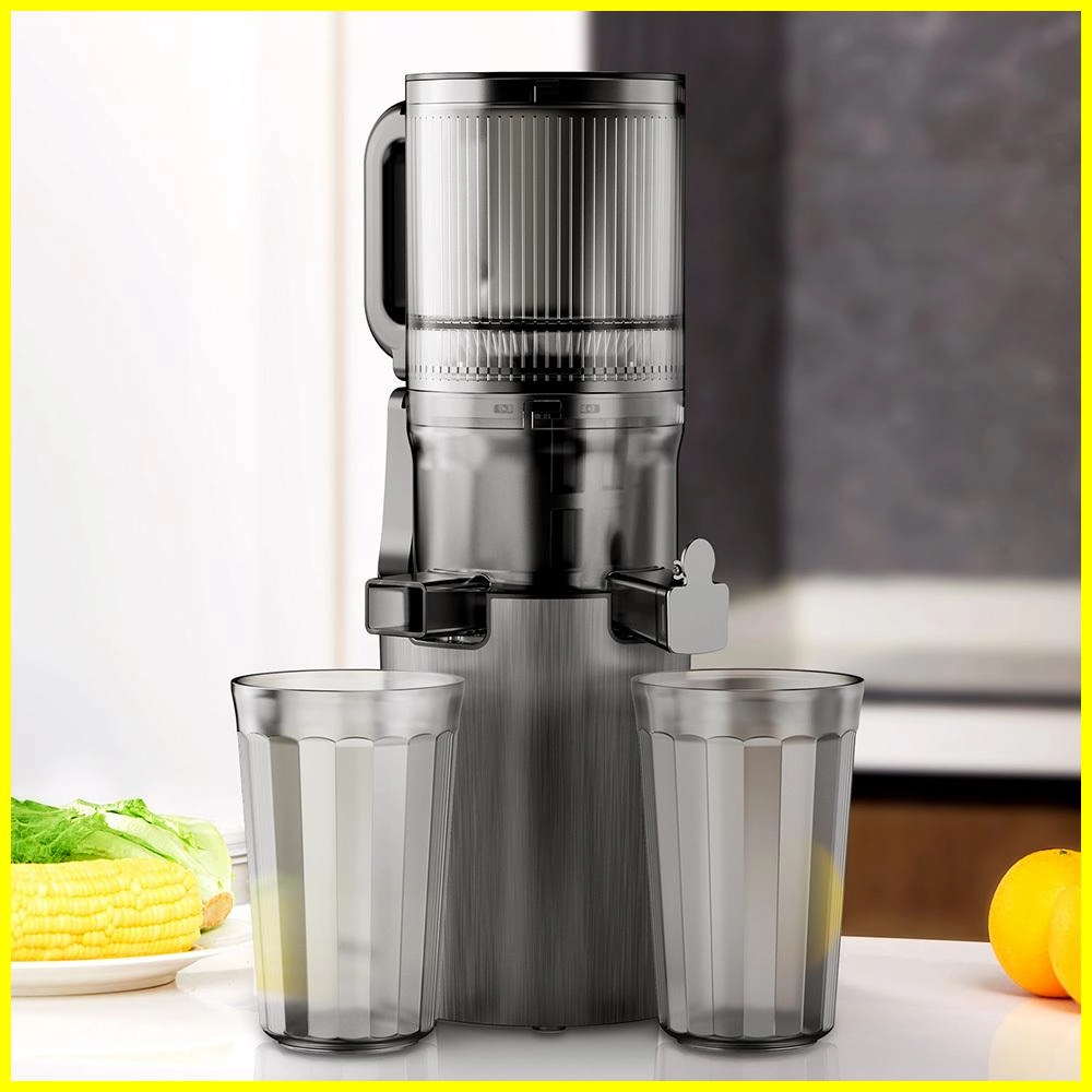 Modern slow juicer with two glasses of juice.