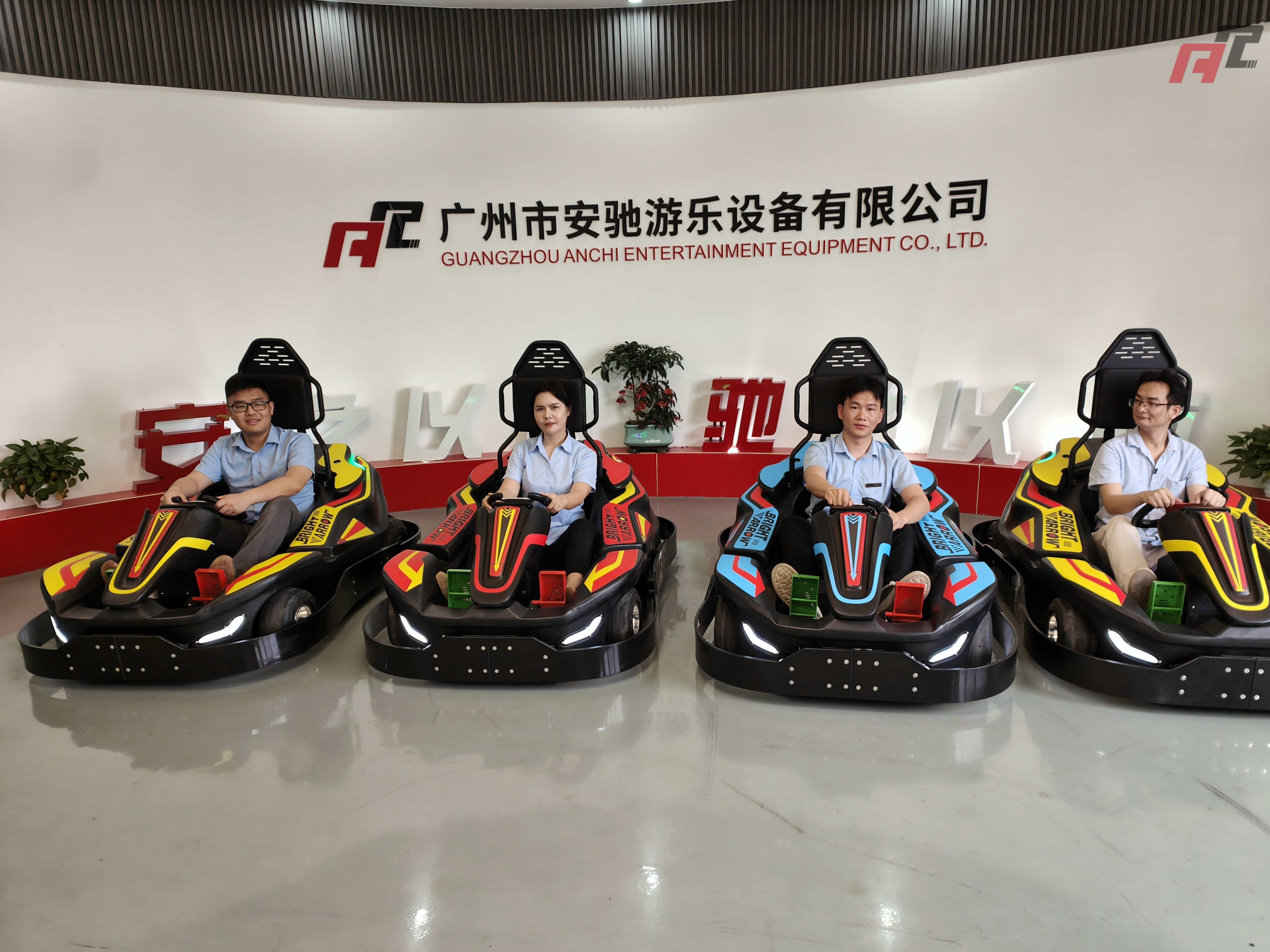 people are driving go karts people are driving go karts