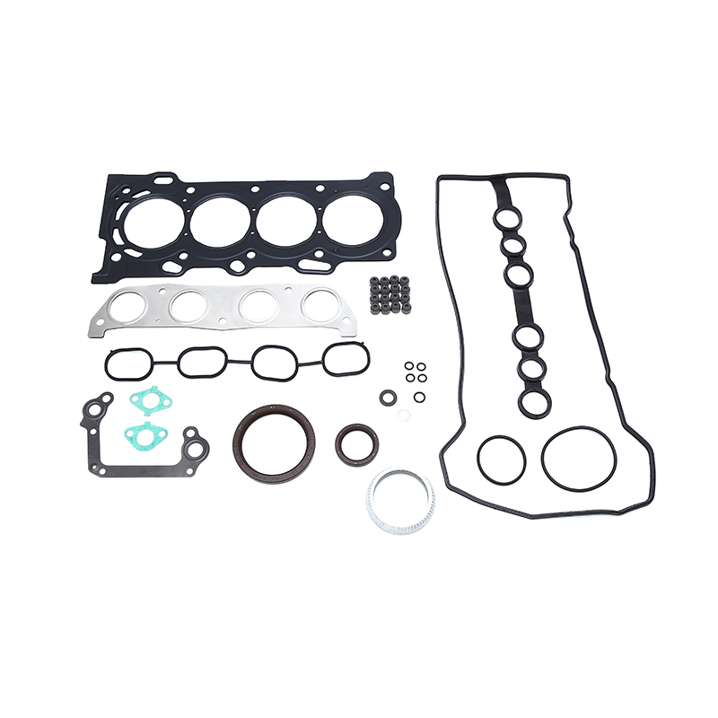 A collection of various gaskets, seals, and fasteners typically included in an engine rebuild kit.